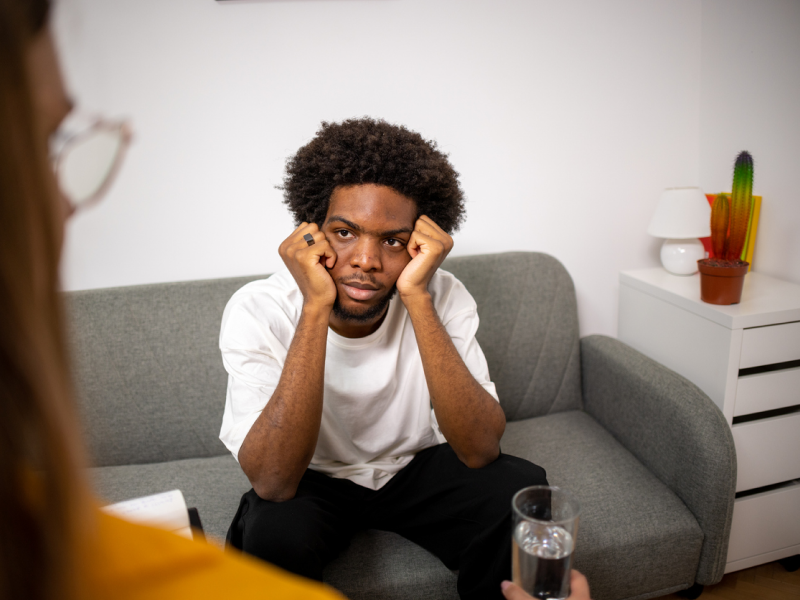 Young adult man dealing with mental health issues