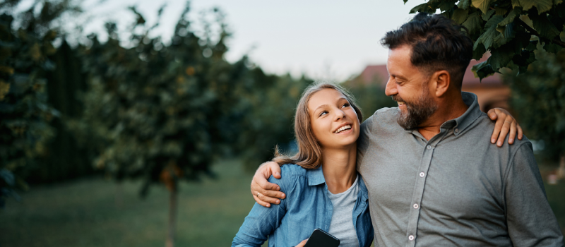 A father is with his daughter who he has gotten support for her for experiencing depression.