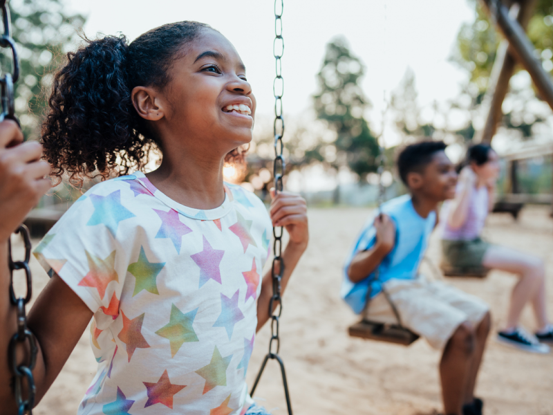 Children playing on swings.