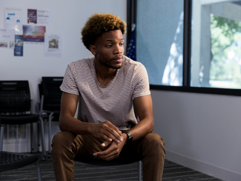 A man sits in the waiting room for inpatient treatment for depression.