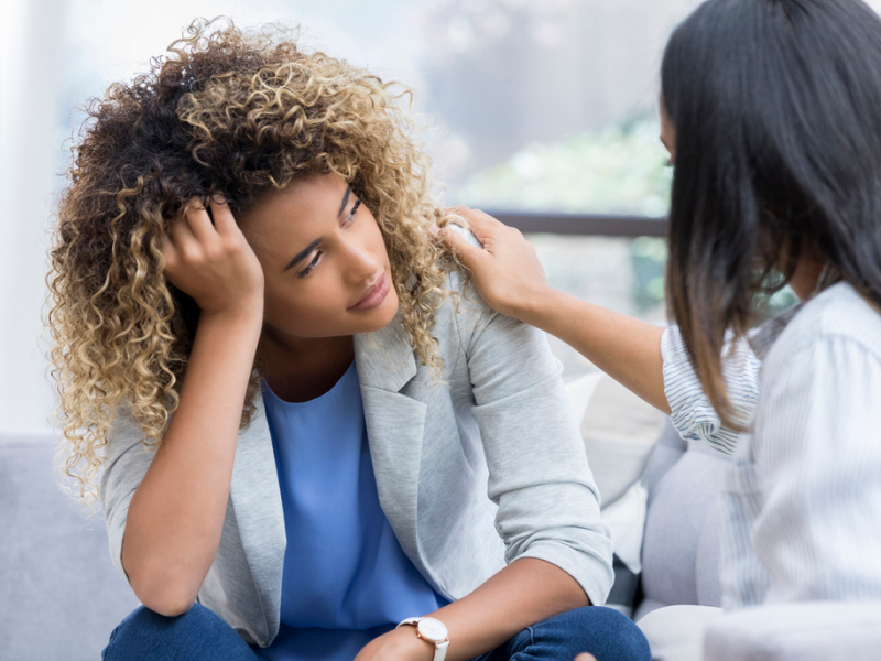 A woman is learning how to stop catastrophizing in a therapy session.