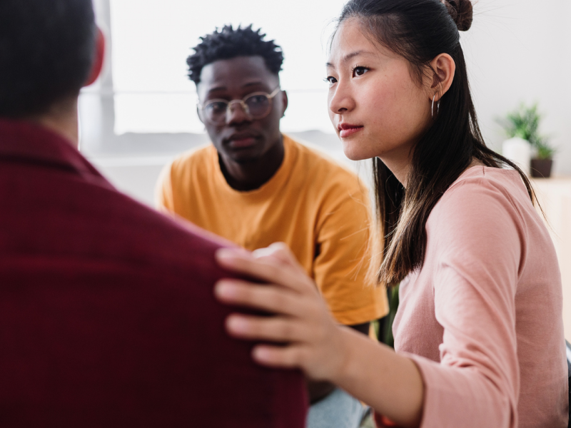 Young adults are in a supported group session in outpatient treatment.