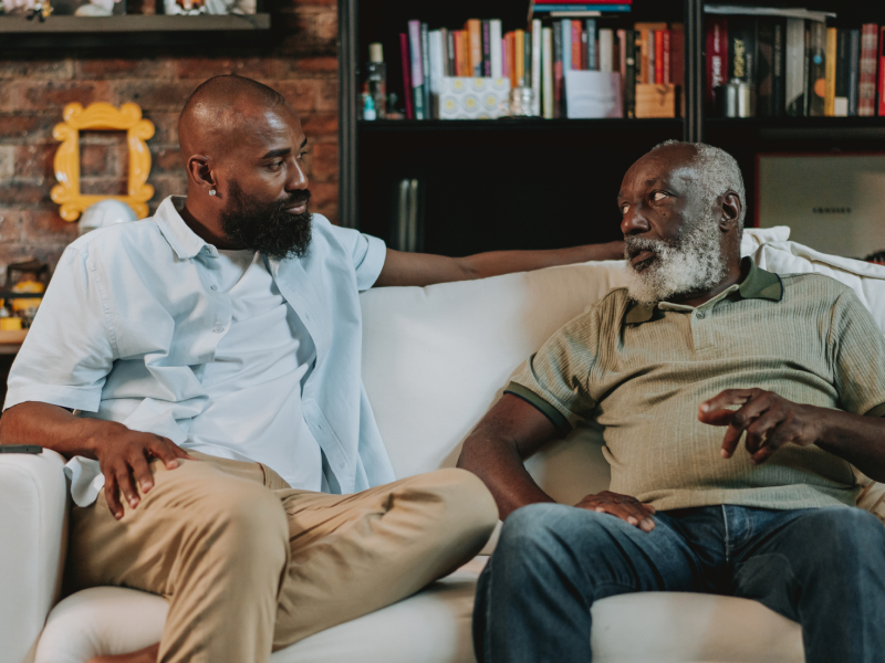 A man sits with his father who has shown signs of being abusive.