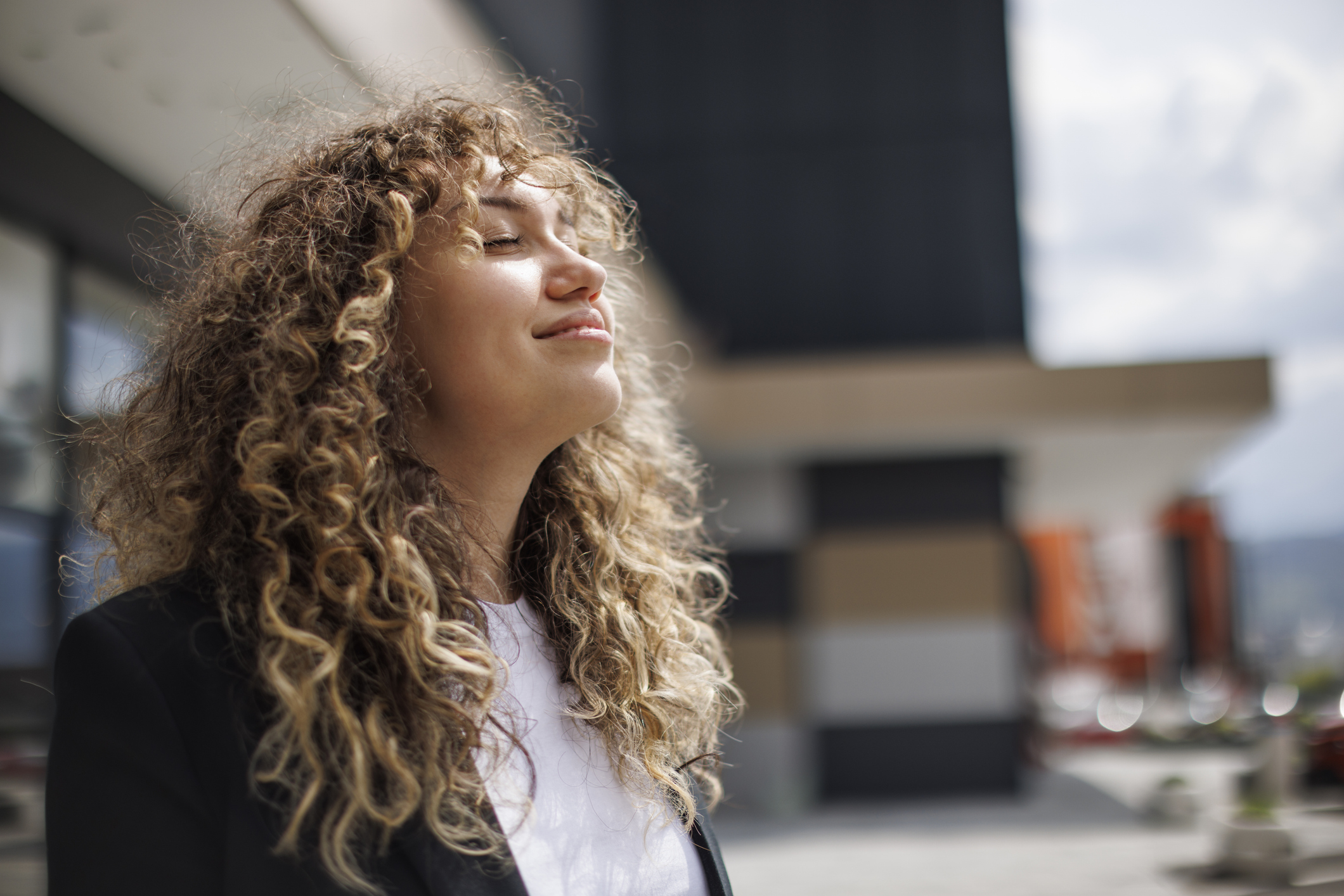 Businesswoman relaxing outdoor and soaking up her happiness after learning how to manage her ADHD and BPD