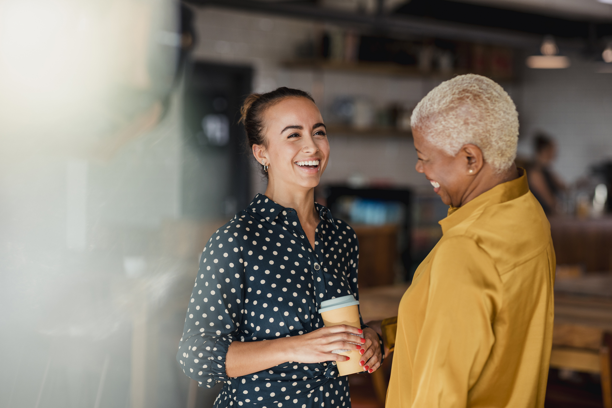 Two co-workers sharing a conversation equally