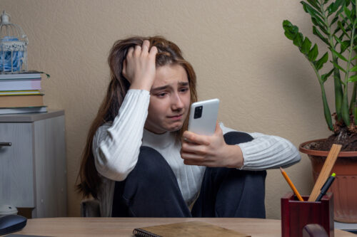 Young girl feeling overwhelmed by her feelings of anger in processing the loss of her mother