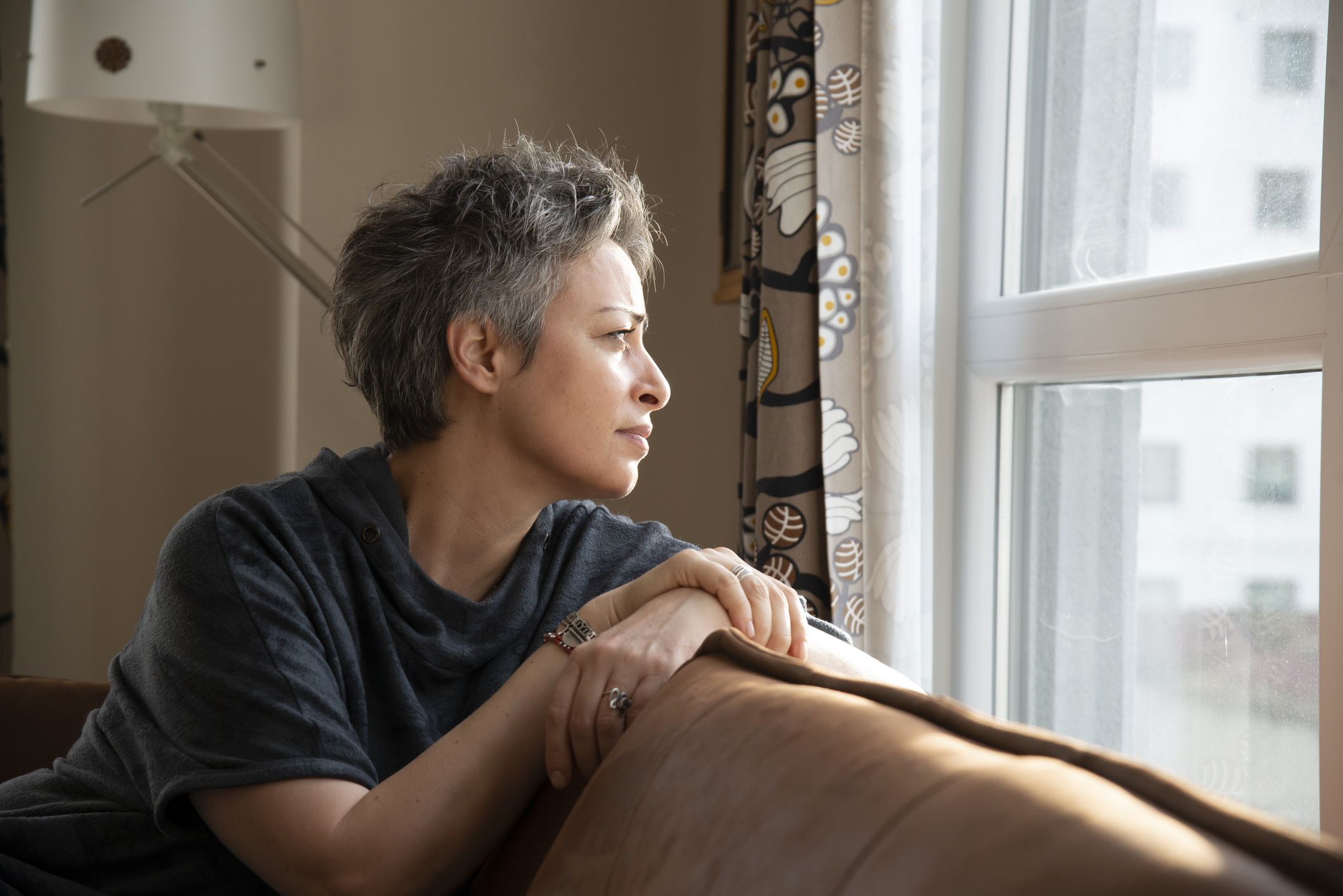 Woman reflecting on her ability to protect her boundaries through grey rocking.