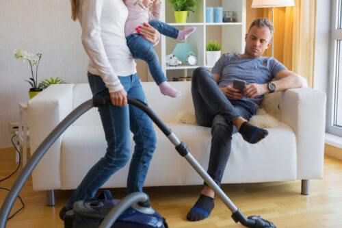 Woman carrying the housework and child care load and husband acts like he doesn't know how to do these things.