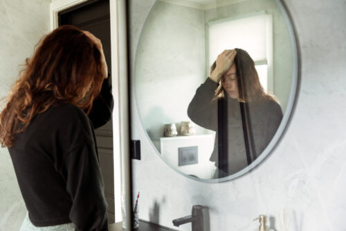 Woman feeling overwhelmed and coming to face the reality that she's an alcoholic.